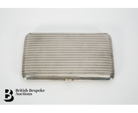 A rectangular silver cigarette case, engine turned, with inscription, foreign marks (rubbed), approx 199.6 gms.