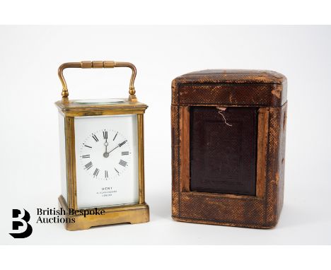 A Dent brass cased carriage clock, the white enamel dial signed Dent 4 Royal Exchange London, 8-day movement striking on a co