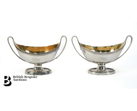 Pair of Georgian silver salt cellars in the neo-classical twin handled style, beaded decoration to borders, gilt interiors, s