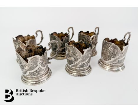 Six silver early 20th century Persian mint tea glass holders, marks to base, engraved with animals.&nbsp;