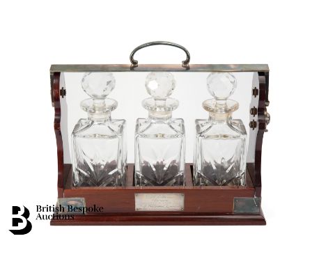 A PB &amp; S silver plated triple tantalus, comprising three cut glass decanters and stoppers, (good condition), with a silve