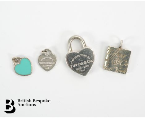 Three Tiffany &amp; Co charms, including a silver lock heart, a square charm and a small Tiffany heart charm all three stampe