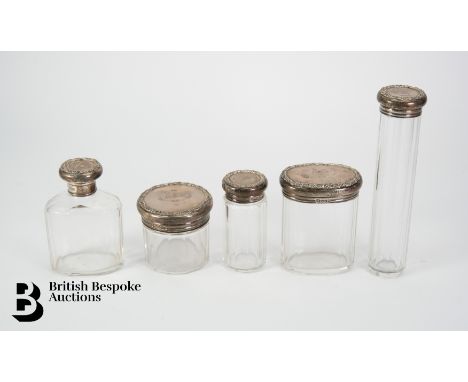 Five silver topped scent bottles, London hallmark dated 1905, mm Drew &amp; Sons, including an oval topped jar and cover, cir