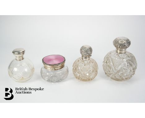 Four large scent bottles including a silver, guilloche enamel and cut glass circular scent bottle, Birmingham hallmark dated 