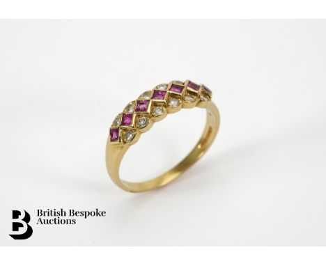 18ct gold ruby and diamond ring. The ring set with seven 1.75mm rubies and approx 20 pts of dias,&nbsp; size P, 4.3 gms.