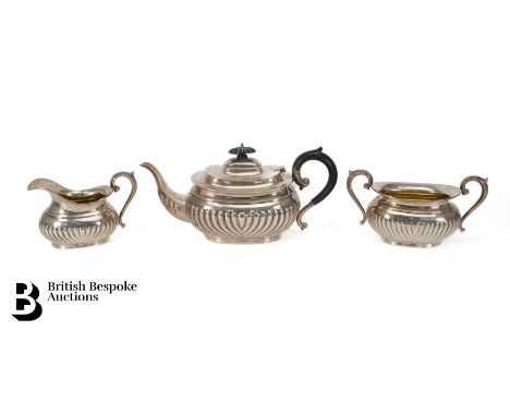 Henry Birks &amp; Co, Canadian sterling silver tea trio, comprising a tea pot with ebony handle and finial, milk jug, twin ha