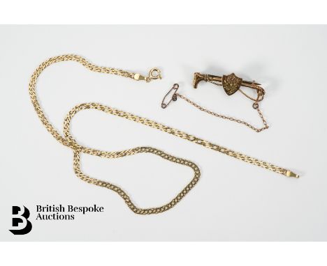 A 9ct gold neck chain, 39 cms together with a riding crop and shield pin brooch 35 mm (with steel pin), gross weight, 6.3 gms