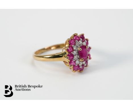 9ct gold ruby and diamond ring, size N, approx 2.3 gms. The ring set with one 6 x 4mm ruby, twelve 2.5mm rubies and approx 18