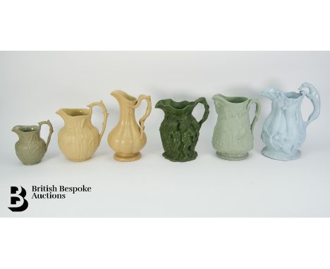 Six 19th century relief moulded jugs, the first depicting bull rushes 19.5 cms h, Ignes &amp; Walley melon-form jug with natu