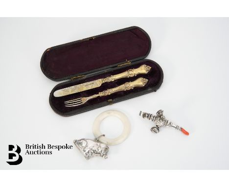 A silver and coral rattle and teething ring, mm George Unite (1864-1910), approx 8 cms, a silver teething ring Birmingham hal
