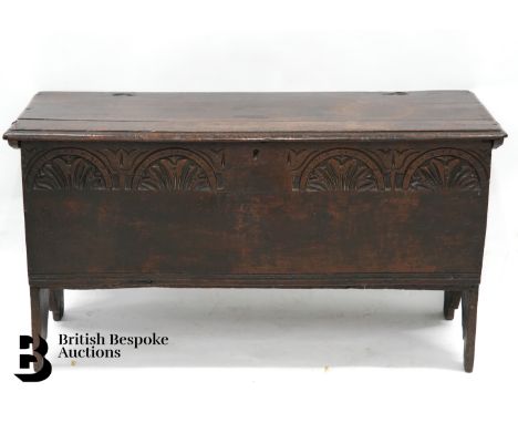 Antique oak coffer, plank top (split) with decorative carving to the front panel, approx 102 x 37 x 55 cms.&nbsp;