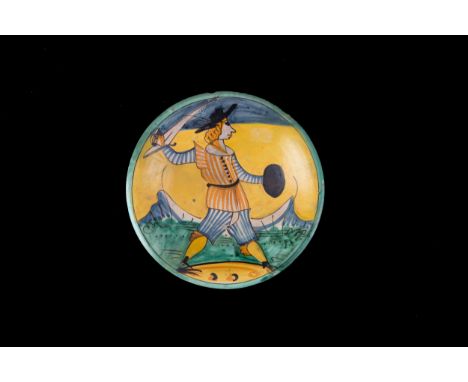 Polychrome majolica plate with soldier in the center. Montelupo. 18th century. Minor defects. Diam. 30.5 cm approx. Piatto in