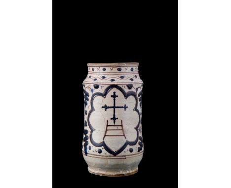 White majolica jug painted in shades of blue and brown with the coat of arms of Santa Maria della Scala in the center. Floren