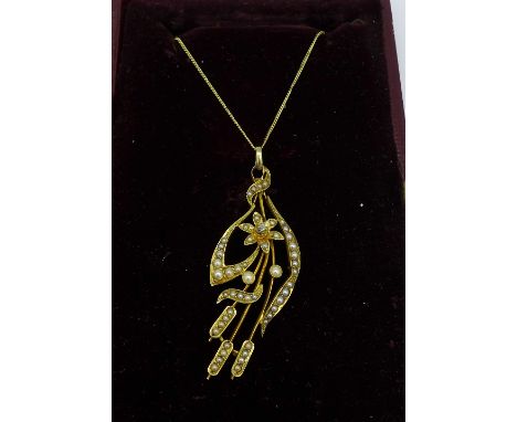 A 15ct gold, pearl and diamond pendant on a silver gilt chain 