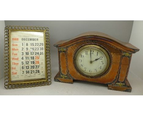 An Art Nouveau mantel timepiece with hammered finish, the movement marked made in France, and a brass framed calendar, clock 