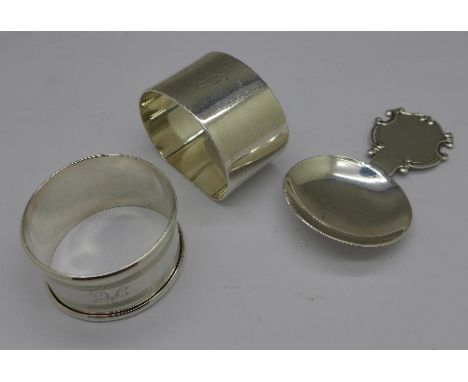 Two silver napkin rings and a silver caddy spoon hallmarked Birmingham 1937