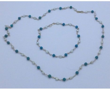 A pearl and blue stone necklace and bracelet