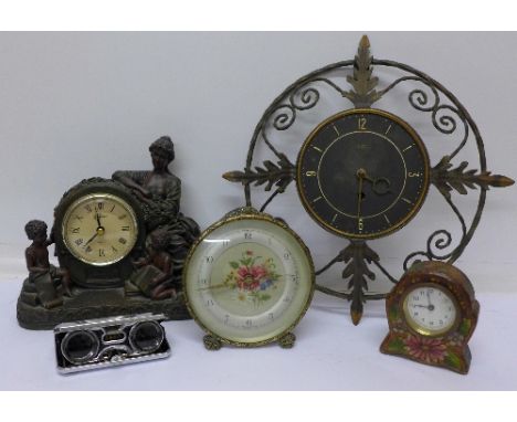 A Juliana figural table clock and two other mantel clocks, an 8-day wall clock and a pair of sports glasses