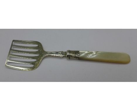 A silver and mother of pearl handled sardine server