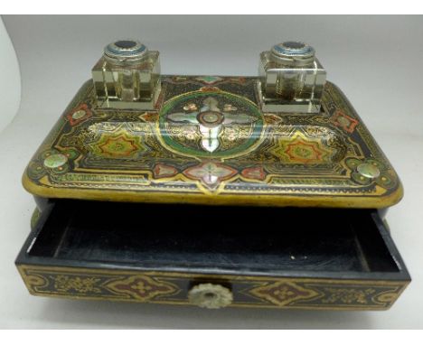 A hand decorated papier-mache inkstand inlaid with mother of pearl, width 26.5cm