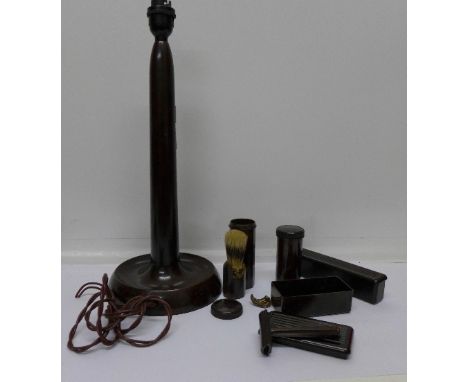 A Bakelite table lamp base and other Bakelite containers
