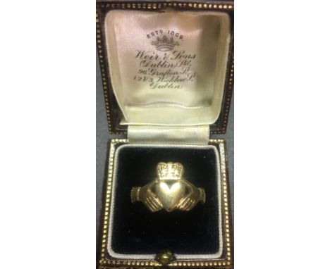 A 9ct gold "Claddagh" Ring, with typical central heart design with hands either side with crown capital, hallmarked. (1)
