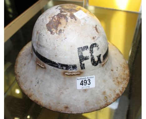 WW2 FIREMANS HELMET. WWII metal Firemans helmet marked FG, from Trafford Park Manchester.