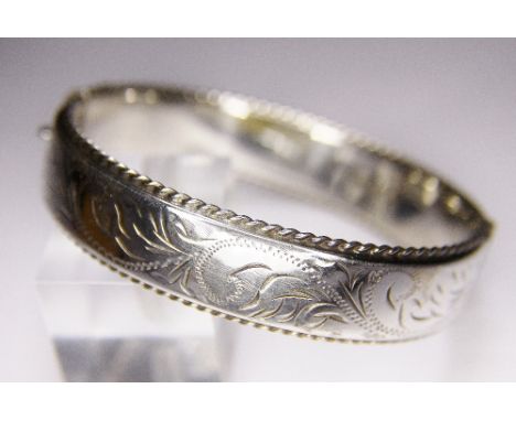 SILVER BANGLE. Sterling silver vintage 1977 engraved bangle