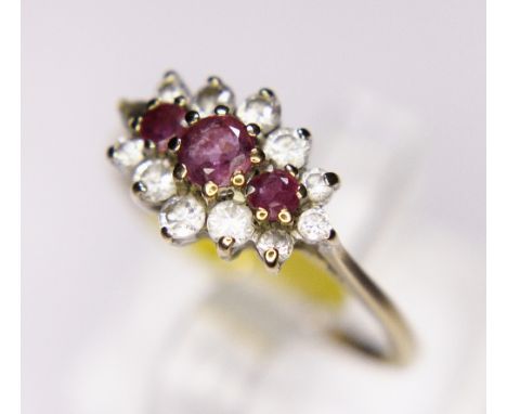 CLUSTER RING. 9ct gold ruby and CZ cluster ring, size M/N