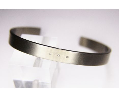 TITANIUM BRACELET. Titanium diamond set bracelet