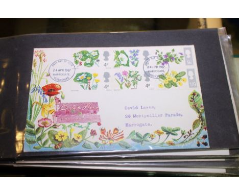 FIRST DAY COVERS. Three albums of worldwide first day covers, approximately 160.
