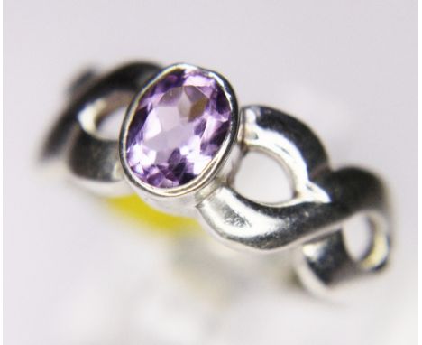 SILVER AND AMETHYST RING. 925 silver twist ring set with amethyst, size Q