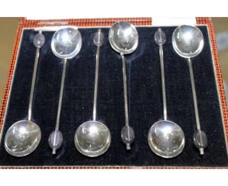 SILVER COFFEE SPOONS. Six silver coffee bean spoons in leather case