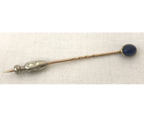 A vintage gold tie/stick pin with sapphire blue coloured cabochon stone to top. Complete with fastening. Tests as 14ct gold. 