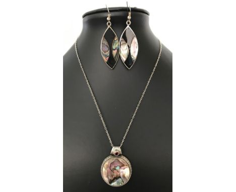 A 925 silver round pendant set with abalone shell and a round garnet, on an 18 inch silver chain. Together with a pair of dro