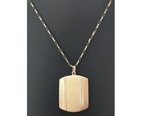 A vintage 9ct gold locket with engine turned decoration to front on a 18 inch box chain. Selling on behalf of Hillside Animal
