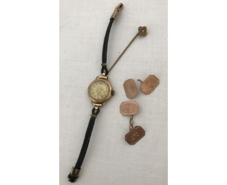 A Victorian gold stick pin together with a 9ct gold cased ladies wrist watch &amp; 9ct gold cufflinks. Stick pin set with a s