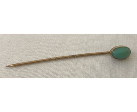 A vintage gold tie/stick pin with turquoise cabochon to top. Tests as 14ct gold. 