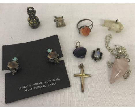 A small collection of silver and other jewellery items. To include silver and moonstone pendant, Mother of Pearl pig pendant,