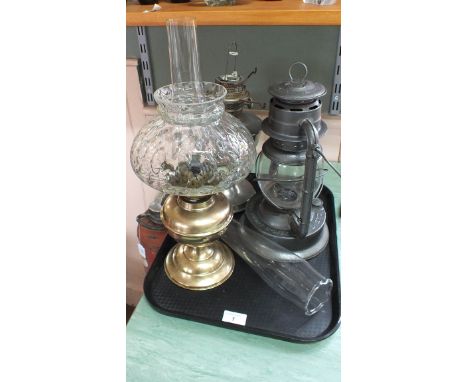 Two oil lamps plus a storm lantern