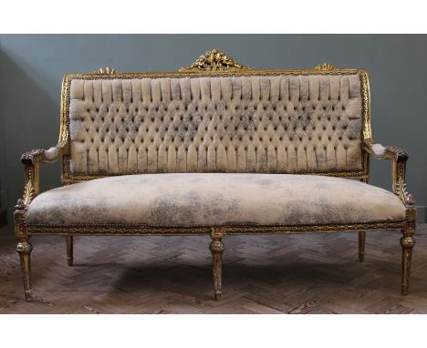 A late 19th Century French gilt sofa with suede upholstery