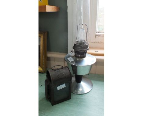 A paraffin carriage lamp by Chas Andrews London plus a 1960's Aladdin chrome oil lamp