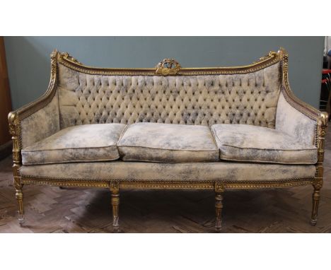 A late 19th Century French gilt sofa with suede upholstery