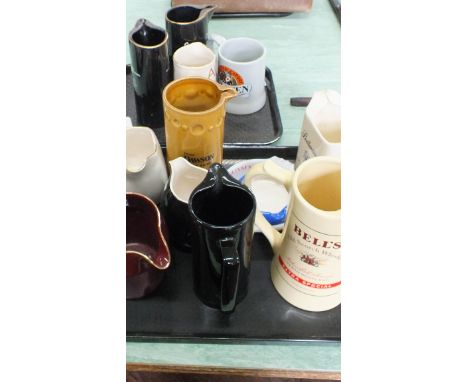 A box containing a quantity of ceramic breweriana including jugs and ashtrays