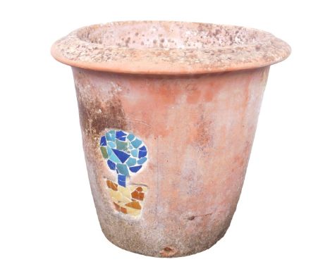 A terracotta garden pot, of cylindrical tapering form with out swept rim, decorated to the front with a mosaic pattern depict