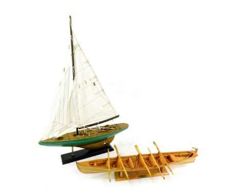 A wooden scale model of a Pilot Gig, with stand, 49cm wide, together with a model of a yacht, on stand, 41cm wide. (2)