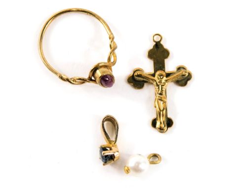 A group of 9ct gold jewellery, comprising a 9ct gold crucifix pendant, a 9ct gold and ruby set dress ring, and two yellow met