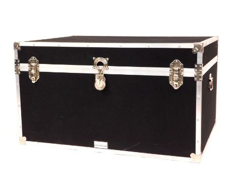 A large cabin type trunk by The Storage Trunk Company, with alloy metal framework and two carrying handles, in black cloth, 5
