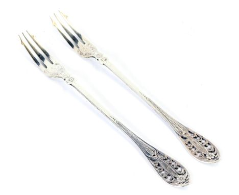 A pair of Victorian silver pickle forks, each with a pierced floral top and engine engraved decoration, maker Charles Boyton 