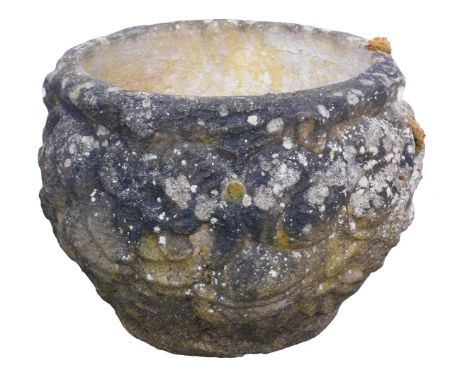 A composition planter, of circular form carved with various motifs, 38cm high, 47cm diameter. 